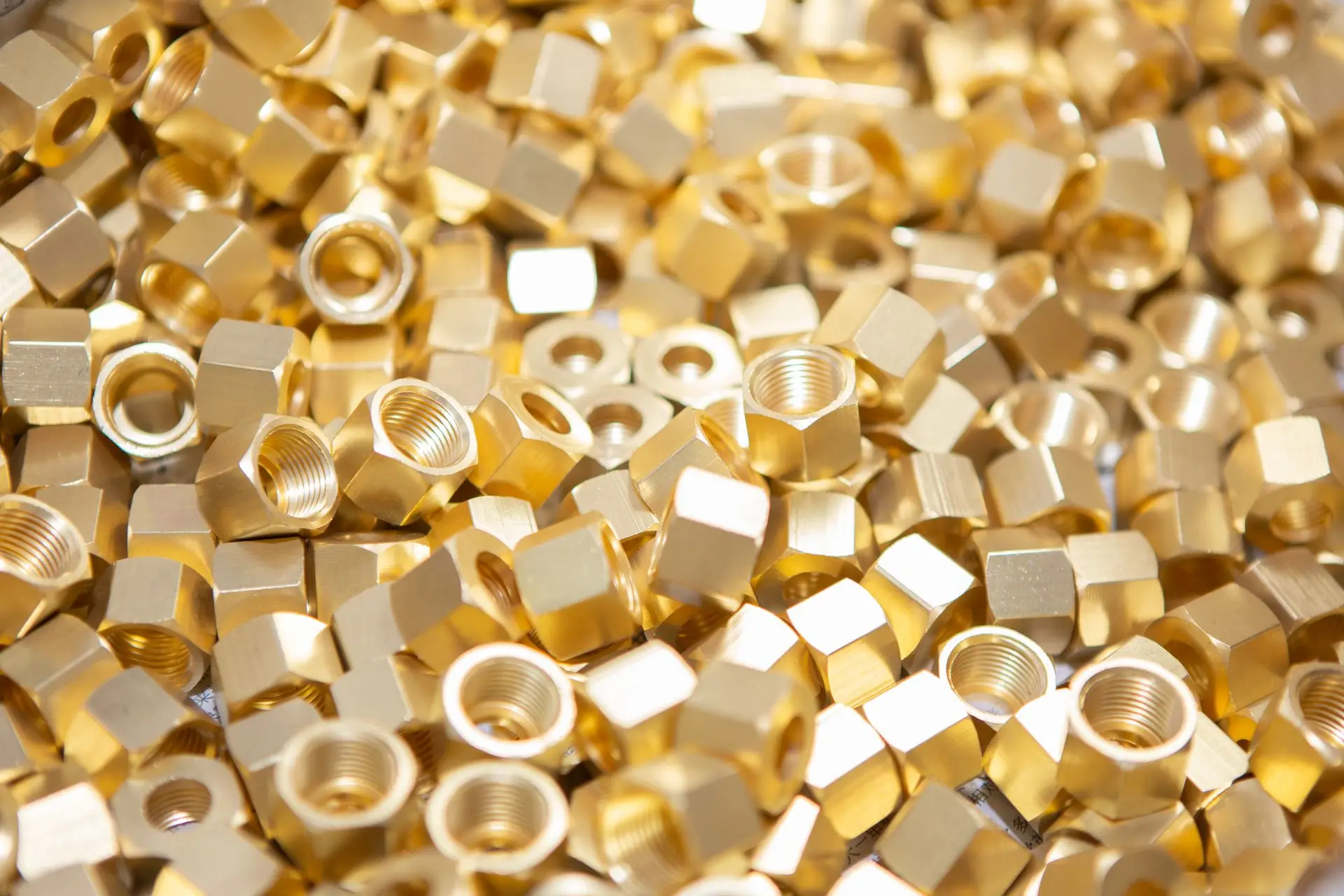 Pile of brass fittings and nuts